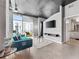 Open-concept living room with city views, contemporary furniture, and a sleek entertainment center at 250 Pharr Ne Rd # 1702, Atlanta, GA 30305