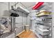 Organized walk-in closet with shelving, hanging racks, and drawer systems for ample storage at 250 Pharr Ne Rd # 1702, Atlanta, GA 30305