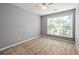 Carpeted bedroom featuring neutral walls and bright window at 3258 Welmingham Sw Dr, Atlanta, GA 30331