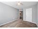 Cozy bedroom with carpet, grey walls, ceiling fan and a view to the bathroom at 3258 Welmingham Sw Dr, Atlanta, GA 30331
