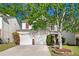 This suburban home features a two-car garage, brick accents, and mature shade trees in a well-maintained neighborhood at 3258 Welmingham Sw Dr, Atlanta, GA 30331