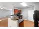 Kitchen featuring tiled backsplash, bar seating, and modern appliances at 3258 Welmingham Sw Dr, Atlanta, GA 30331