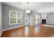 Open living room with hardwood floors and fireplace, with lots of natural light at 3258 Welmingham Sw Dr, Atlanta, GA 30331
