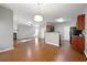 Spacious open living room with hardwood floors shared with kitchen, fireplace, and plenty of natural light at 3258 Welmingham Sw Dr, Atlanta, GA 30331