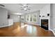 Open living room with hardwood floors, fireplace, and large windows for natural light at 3258 Welmingham Sw Dr, Atlanta, GA 30331