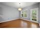 Open living room with hardwood floors and access to backyard at 3258 Welmingham Sw Dr, Atlanta, GA 30331