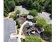 Overhead view of a colorful community playground, gazebo, and double basketball courts surrounded by trees at 3258 Welmingham Sw Dr, Atlanta, GA 30331