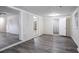Spacious basement featuring modern wood flooring, white trim, and ample natural light at 4094 E Glade Ct, Decatur, GA 30035