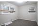 Bright bedroom featuring two windows and carpeted floors at 4094 E Glade Ct, Decatur, GA 30035