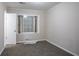 Cozy bedroom with neutral carpeting and large window, ready for personalization at 4094 E Glade Ct, Decatur, GA 30035