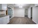 A dining area with modern light fixture and wood flooring at 4094 E Glade Ct, Decatur, GA 30035