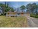 Charming single-story home with a well-maintained lawn and a long private driveway at 4094 E Glade Ct, Decatur, GA 30035