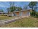 A single-story home with a well-maintained lawn and a long private driveway at 4094 E Glade Ct, Decatur, GA 30035