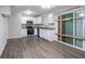 Modern kitchen featuring stainless steel appliances, granite countertops, and wood flooring at 4094 E Glade Ct, Decatur, GA 30035