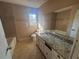 Bright bathroom with granite countertop and tile flooring at 4820 Banner Elk Dr, Stone Mountain, GA 30083
