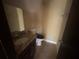 Modest bathroom featuring a toilet, vanity with granite countertop and sink at 4820 Banner Elk Dr, Stone Mountain, GA 30083