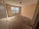 Neutral bedroom featuring a large window to let in natural light at 4820 Banner Elk Dr, Stone Mountain, GA 30083