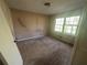 Standard bedroom featuring a large window allowing for ample natural light at 4820 Banner Elk Dr, Stone Mountain, GA 30083