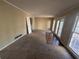 Large living room featuring windows and a sliding glass door to the outside at 4820 Banner Elk Dr, Stone Mountain, GA 30083