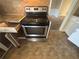 Close up of a stainless steel range and white cabinets at 4820 Banner Elk Dr, Stone Mountain, GA 30083