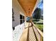 Wide front porch with wood ceiling and railing, perfect for relaxing outdoors at 1266 Elizabeth Sw Ave, Atlanta, GA 30310