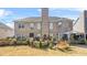 A spacious backyard features a lush lawn, a patio, and well-maintained landscaping, perfect for outdoor activities at 165 Babbling Brook, Mcdonough, GA 30252
