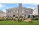 A spacious backyard features a lush lawn, a patio, and well-maintained landscaping, perfect for outdoor activities at 165 Babbling Brook, Mcdonough, GA 30252