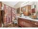 Stylish bathroom featuring a dark wood vanity and eye-catching designer-inspired shower curtain at 165 Babbling Brook, Mcdonough, GA 30252