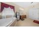 Bright bathroom with corner tub, and vanities, tile floors, and a stainless steel refrigerator at 165 Babbling Brook, Mcdonough, GA 30252