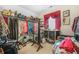 Walk-in closet with rod and shelf storage for handbags, clothes and shoes, as well as a large floor mirror at 165 Babbling Brook, Mcdonough, GA 30252