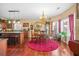 Dining room with wood floors, chandelier, and view of kitchen counter at 165 Babbling Brook, Mcdonough, GA 30252