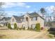 Traditional two-story brick home with a well-maintained lawn and manicured landscaping at 165 Babbling Brook, Mcdonough, GA 30252