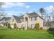 Traditional two-story brick home with a well-maintained lawn and manicured landscaping at 165 Babbling Brook, Mcdonough, GA 30252