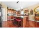 Spacious kitchen island with cherry-stained cabinets and stainless steel appliances at 165 Babbling Brook, Mcdonough, GA 30252