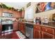 Kitchen featuring stainless steel appliances, dark wood cabinets, and tile backsplash at 165 Babbling Brook, Mcdonough, GA 30252
