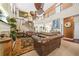 Elegant living room featuring high ceilings, a fireplace, and classic leather furniture at 165 Babbling Brook, Mcdonough, GA 30252