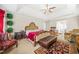 Large main bedroom featuring a tray ceiling, sitting area and neutral walls at 165 Babbling Brook, Mcdonough, GA 30252