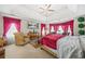 Main bedroom featuring large windows, tray ceiling, and ornate drapes at 165 Babbling Brook, Mcdonough, GA 30252