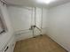 Utility basement space with tile flooring and visible pipes at 211 Wellington Sw St, Atlanta, GA 30314