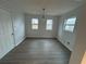 Dining room featuring modern lighting and wood look flooring at 211 Wellington Sw St, Atlanta, GA 30314