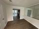 Dining room with wood-look floors open to kitchen with stainless appliances at 211 Wellington Sw St, Atlanta, GA 30314