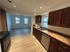Modern kitchen with stainless steel appliances and wood look flooring at 211 Wellington Sw St, Atlanta, GA 30314