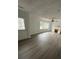 Bright living room featuring wood-look floors, fireplace and large windows at 211 Wellington Sw St, Atlanta, GA 30314