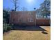 Two-story brick home featuring a spacious backyard and mature trees at 4625 Orkney Sw Ln, Atlanta, GA 30331