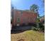 Brick home with a well-maintained lawn and a fenced backyard at 4625 Orkney Sw Ln, Atlanta, GA 30331