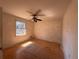 Bedroom featuring hardwood floors, natural light from the window, and a ceiling fan at 4625 Orkney Sw Ln, Atlanta, GA 30331