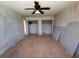 Spacious bedroom featuring hardwood floors, ceiling fan, and double closets at 4625 Orkney Sw Ln, Atlanta, GA 30331