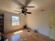 Bedroom with hardwood floors, a ceiling fan, and natural light from the window at 4625 Orkney Sw Ln, Atlanta, GA 30331