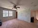Bright bedroom with hardwood floors, a ceiling fan, and natural light from a large window at 4625 Orkney Sw Ln, Atlanta, GA 30331
