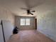Bedroom with hardwood floors, a ceiling fan, and a large window at 4625 Orkney Sw Ln, Atlanta, GA 30331